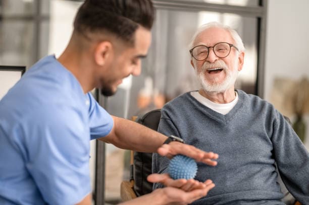 Male physiotherapist visitor in a nursing home